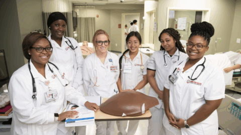 students in white lab coats