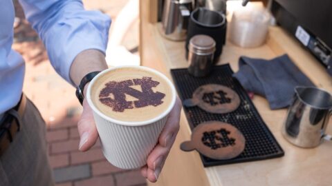 Photo of a cup of coffee with the UNC logo